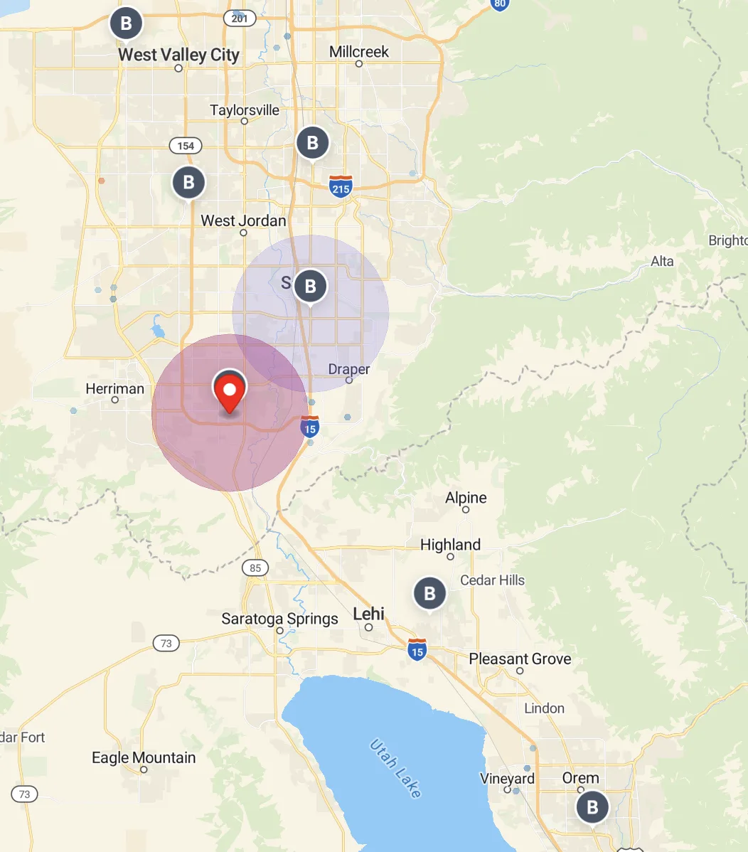 Salt Lake City southern suburbs. Two overlapping circles of roughly equal size sit on the Riverton-Draper corridor. Same suburban radius.