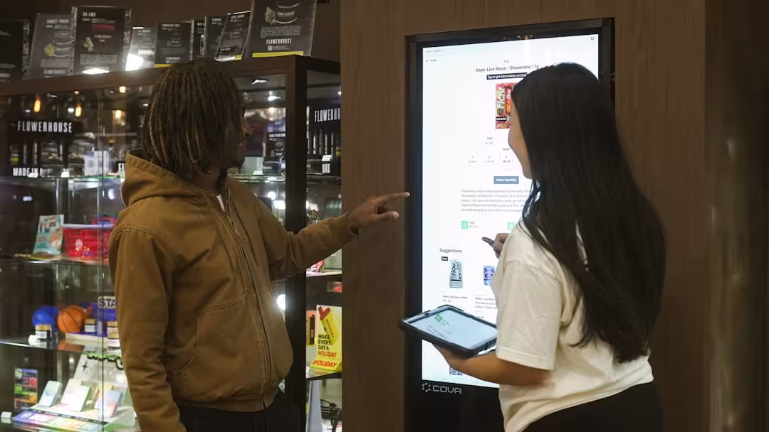 customers engaging with an interactive display in a pop-up store - pop up real estate