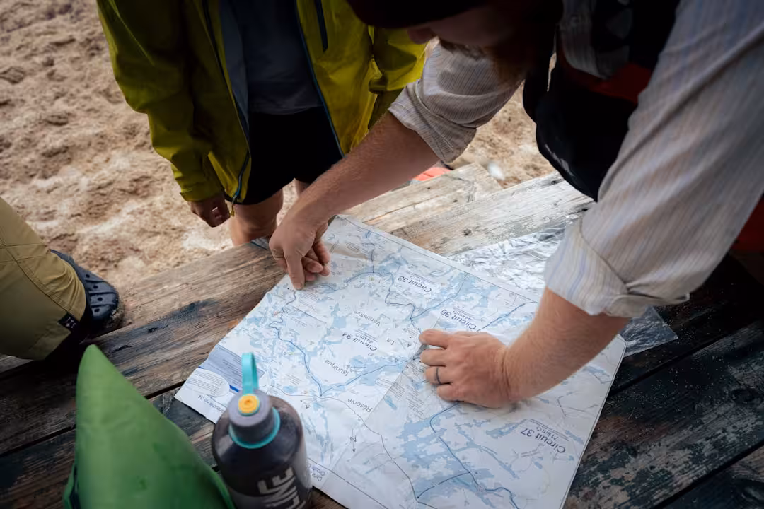 team collaborating over maps and documents - site selection real estate