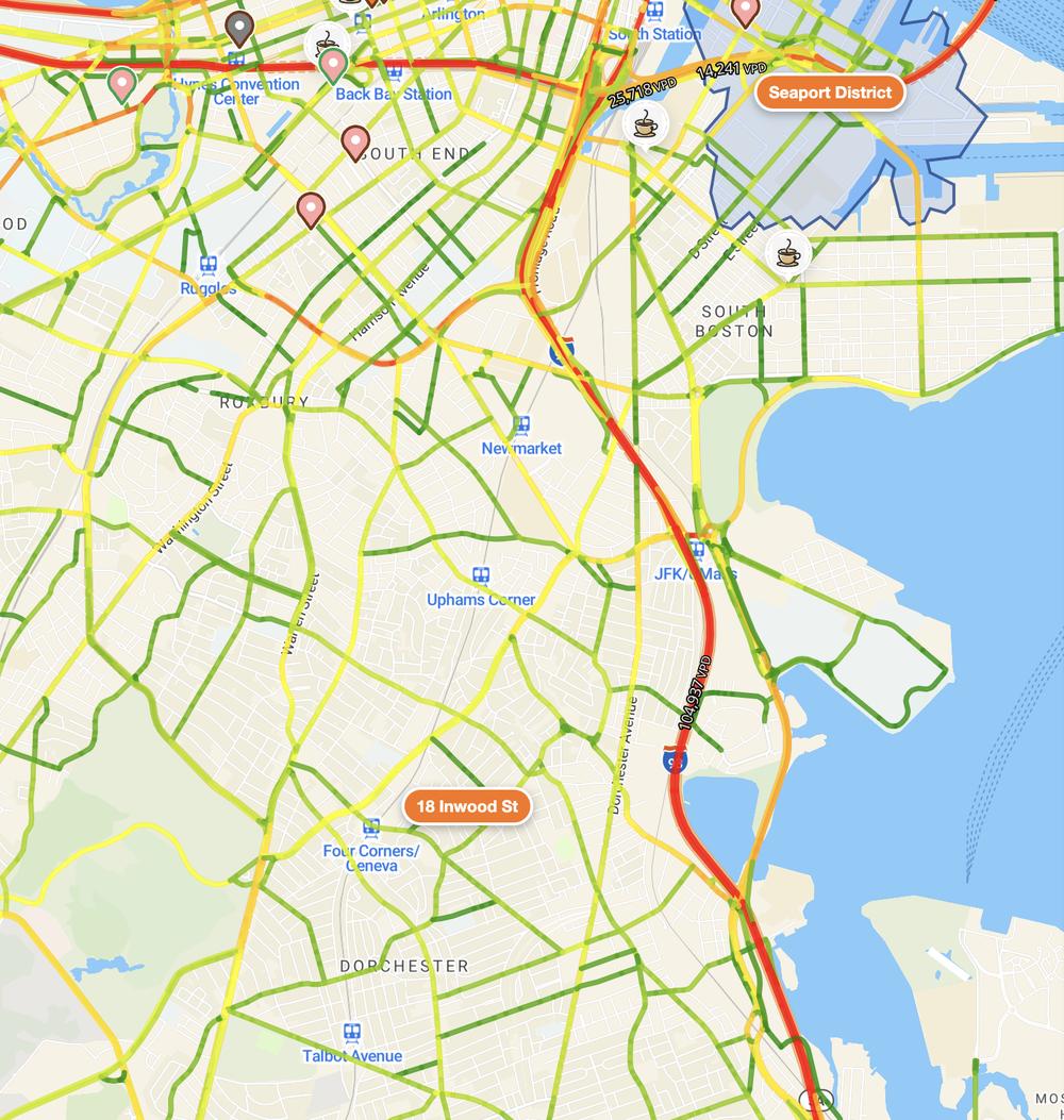 Vehicle traffic over Boston: every road segment colored by daily volume, with vehicles-per-day labels on the busiest.