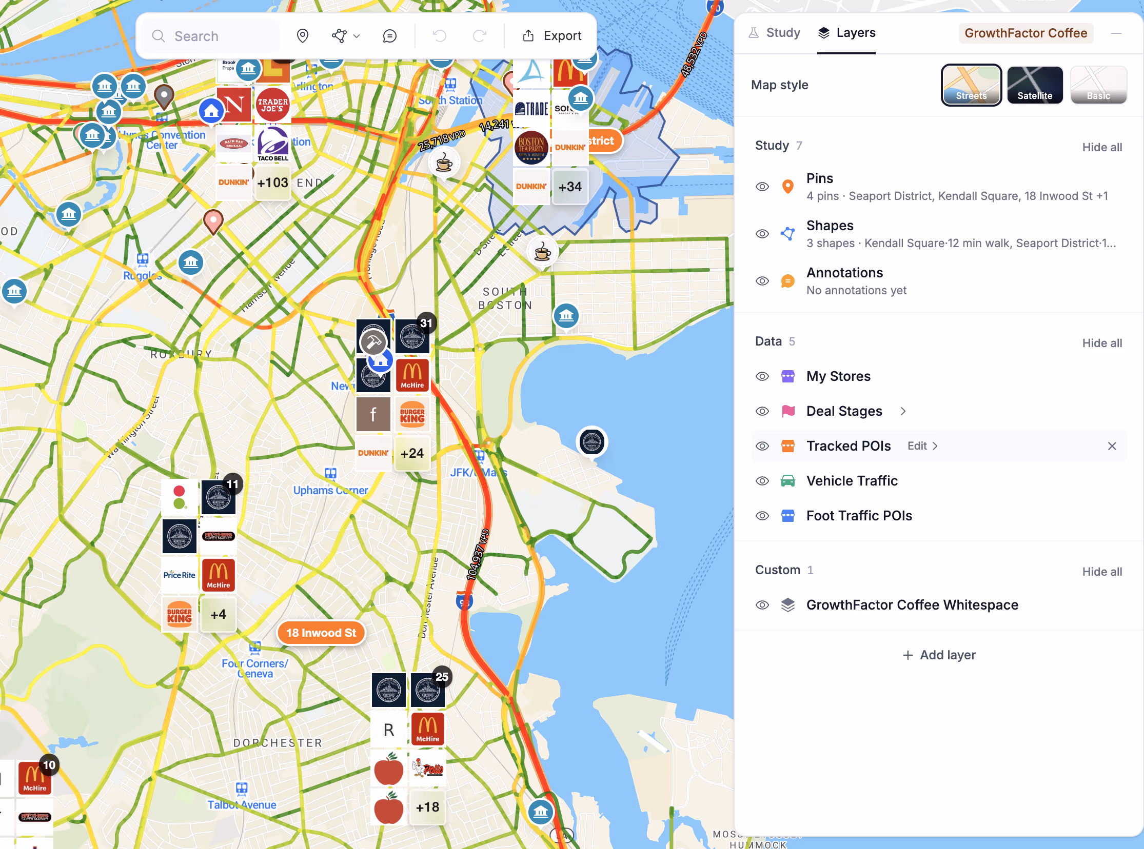 A Boston study with tracked brands switched on: clusters of restaurant logos across the neighborhoods, over roads colored by daily traffic, and the layers panel on the right.